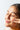 Woman rubs coconut oil into skin